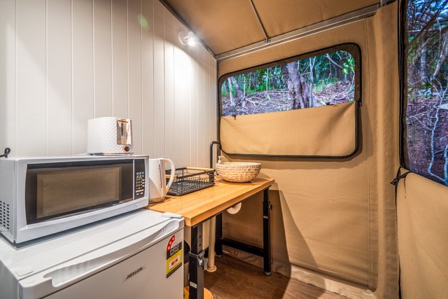 Tent 3 kitchenette with microwave, kettle, bar fridge and bench, Magnetic Glamping