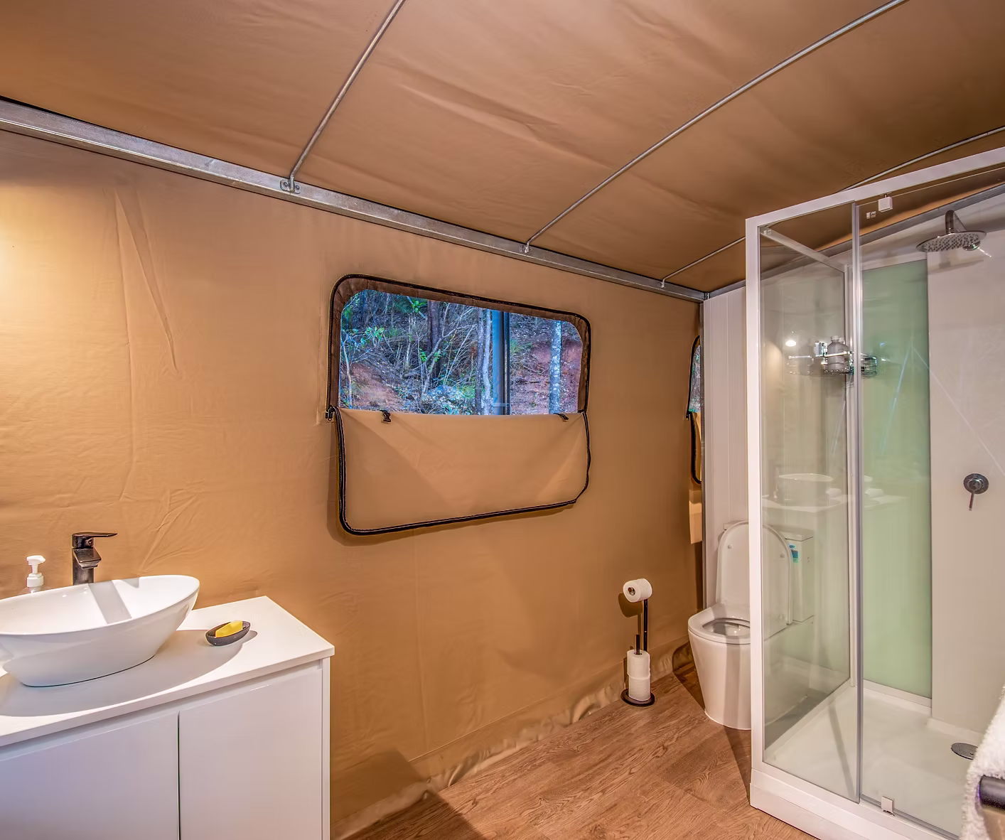 Tent 5 exterior and tropical garden surroundings at Magnetic Glamping