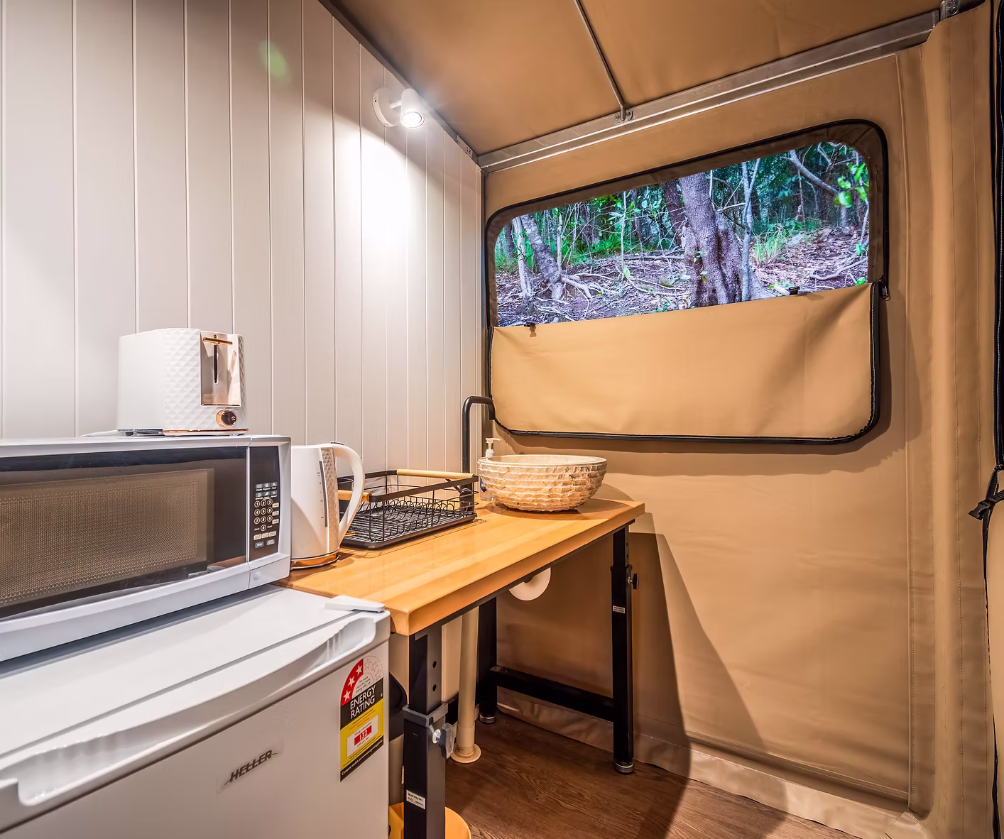 Tent 2 exterior and tropical garden surroundings at Magnetic Glamping