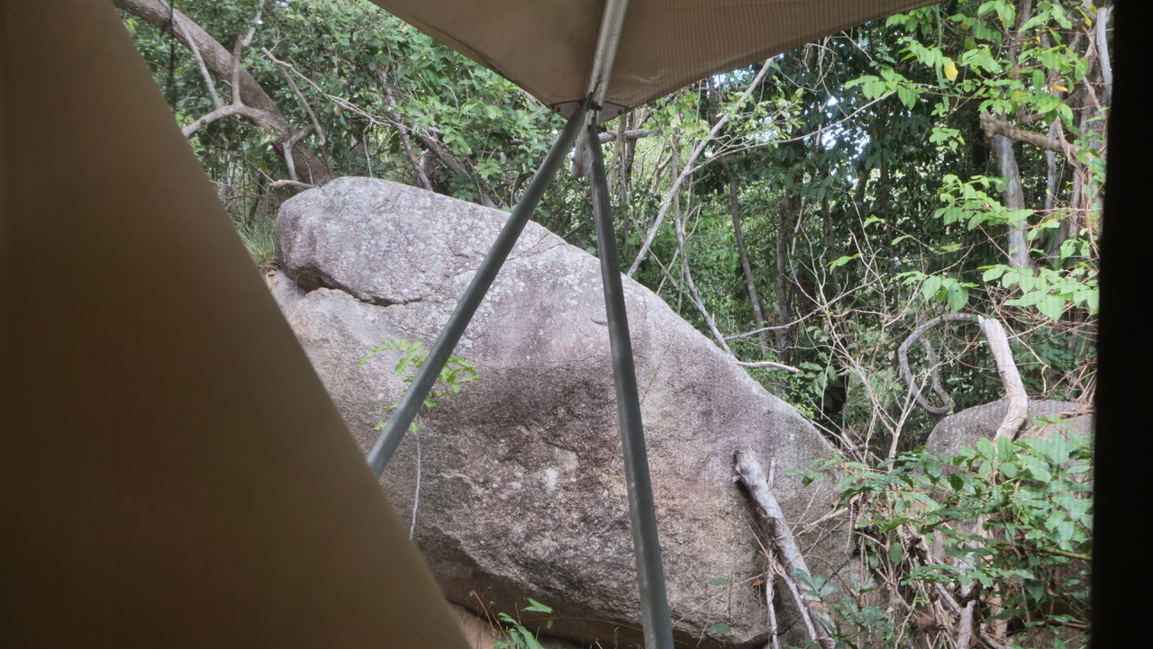 The view from a Magnetic Glamping tent: giant granite boulders and native bushland just beyond the canvas