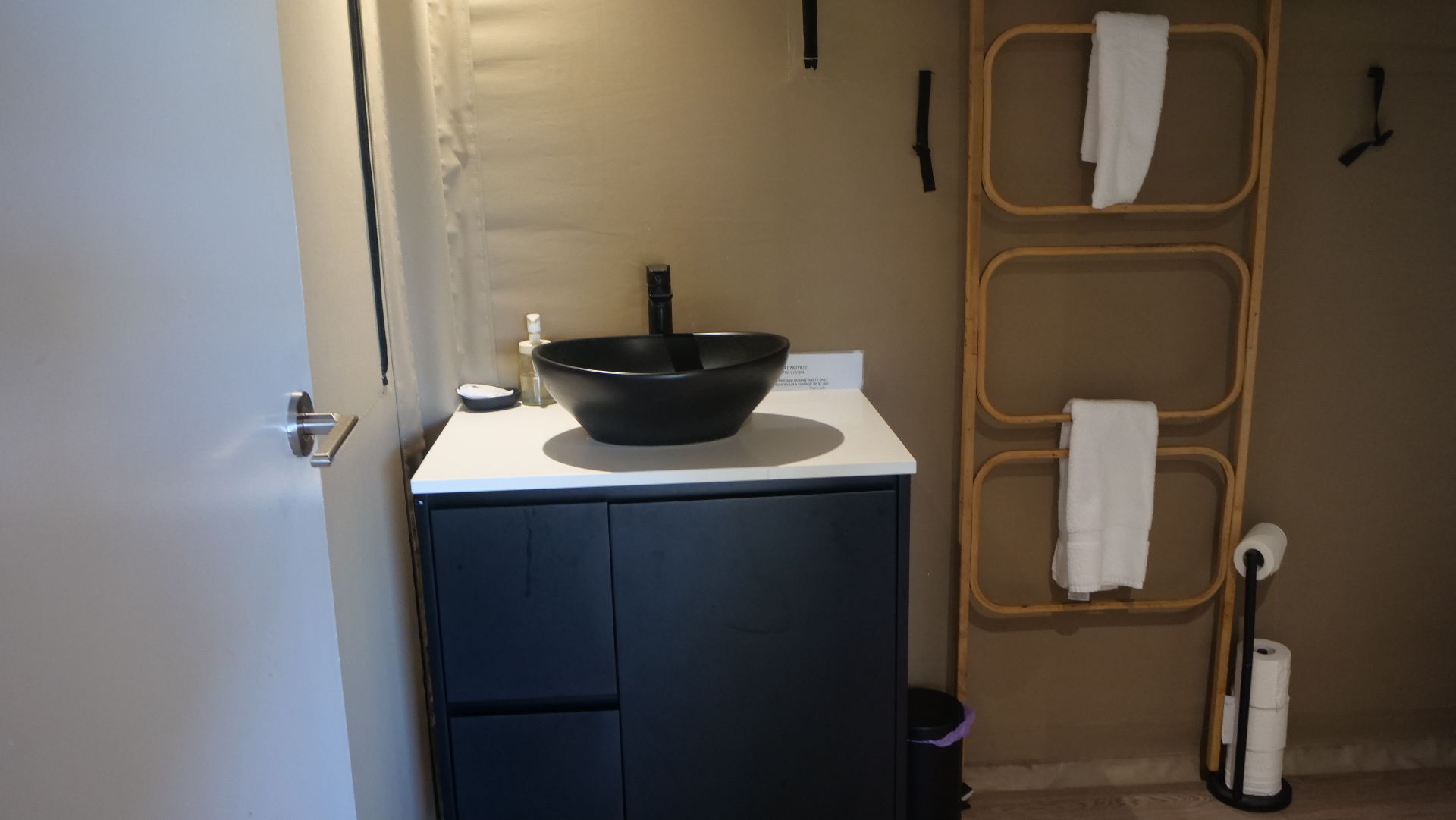 Bathroom basin with mirror inside a Magnetic Glamping safari tent