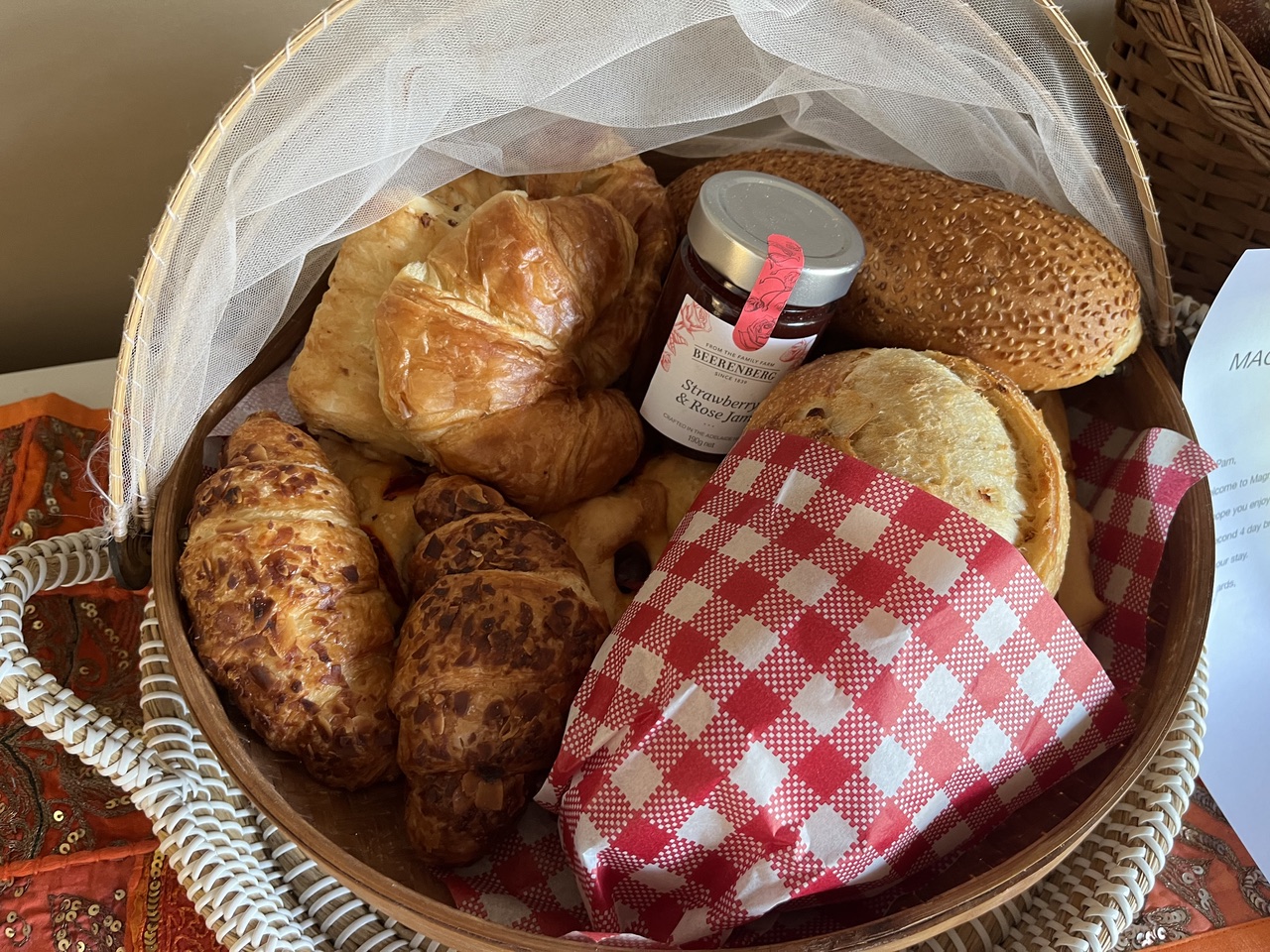 Breakfast basket of pastries, bread and jam delivered to a tent at Magnetic Glamping